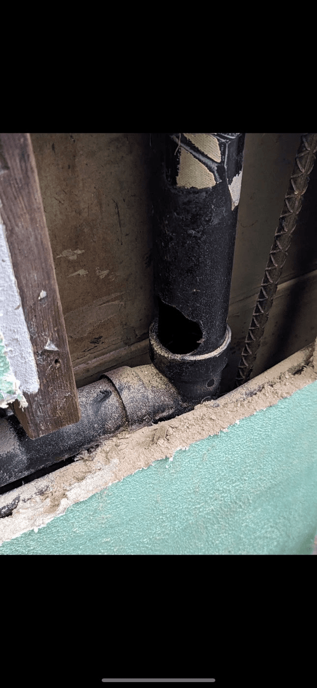 Entry point at pipe penetration — sealed during exclusion